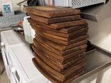 a stack of bread sitting on top of a washer and dryer