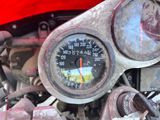 a close up of a speedometer on a motorcycle
