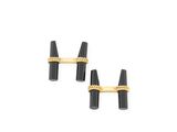 a pair of black and gold cufflinks on a white background