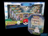 deux boîtes de cartes Pokémon contenant chacune une figurine Pokémon