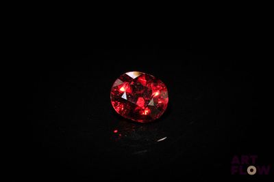 a red diamond on a black surface