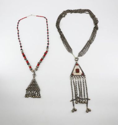 two silver and red beaded necklaces and a silver and red beaded necklace