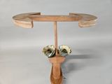 a wooden stand with two bowls on it