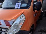 an orange van that is parked in a lot