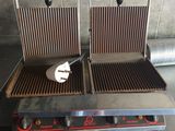 two grills that are sitting on top of a counter
