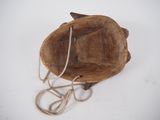 a wooden bowl with a rope around it on a white surface