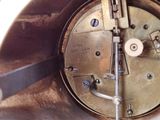 a close up of a clock that is on a table