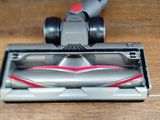 a vacuum that is sitting on a wooden floor