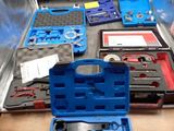 a blue tool case with tools in it on a table