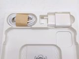 a white tray with a charger and a charger attached to it