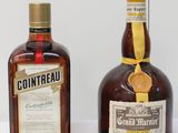 two bottles of liquor sitting next to each other on a table