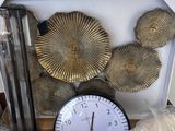 a clock that is sitting on a table next to other items