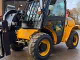 a small yellow fork truck parked in a parking lot