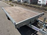 a trailer that is parked on the side of the road