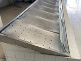 an image of a commercial kitchen with stainless steel counter tops