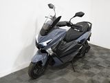 a motorcycle that is parked in the corner of a room