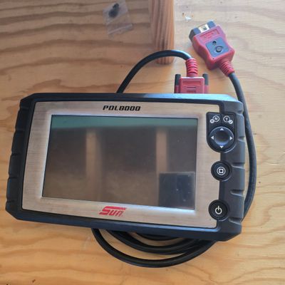 an image of a handheld computer on a wooden table