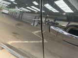 a close up of a car ' s door handle and door handle