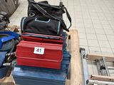 a lot of tools sitting on a pallet on the floor