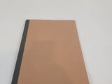 an image of a piece of brown paper sitting on top of a white table