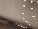 a close up of a metal object with holes in it