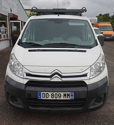 a white van that is parked in a parking lot