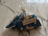 a bag of cookies sitting on a marble table