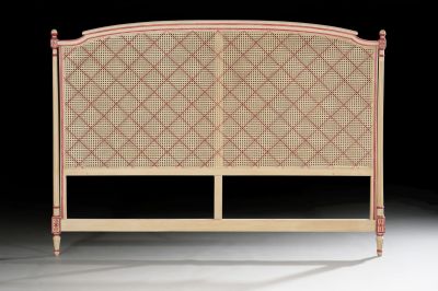 the headboard of the bed is made of rattan and wood