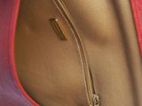 an image of a close up of a purse with a zipper on it