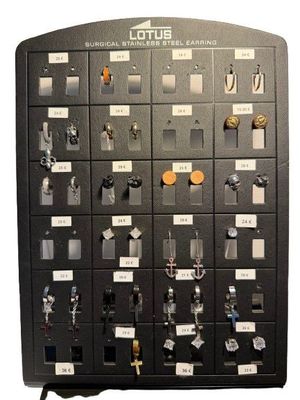a black control panel with lots of buttons on it