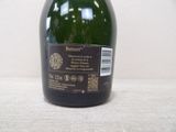 a bottle of wine that is sitting on a table