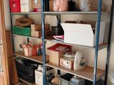 a room that has a shelf with boxes and boxes on it
