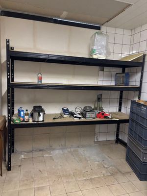 a room that has a shelf with many items on it