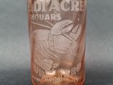 a glass bottle that has a picture of a crab on it