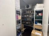 a room with a lot of shelves and boxes