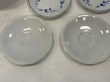 several plates and bowls on a table with a bowl and a plate