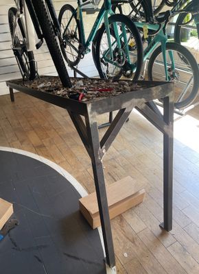 many bikes that are sitting on top of a table