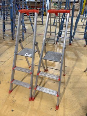 many ladders that are sitting on the floor