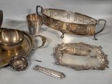 a lot of silver items that are on a table