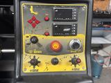 a close up of a machine that is sitting in a garage