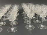 a lot of wine glasses sitting on a table