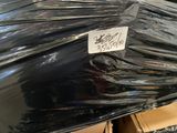 a black umbrella that has a price tag on it