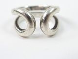silver plated ring with two open circles on a white background