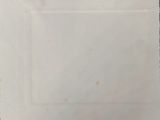 an old book with a black and white drawing on it