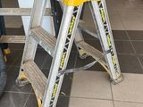 a ladder that is sitting in the middle of the floor