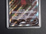 an image of a pokemon card with a picture of a person
