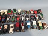 a lot of toy trains that are sitting on a table