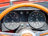 a close up of a steering wheel and gauges on a car
