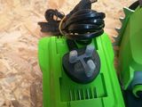 two greenworkss vacuums and a corded blower on the floor