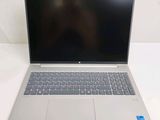 an open laptop computer sitting on top of a white table